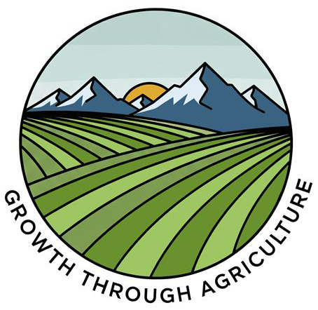 GTA Logo round with green fields and blue mountains