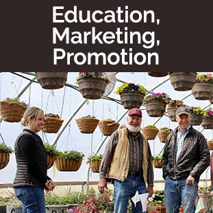 Director Streit in vest, Gov Gianforte in flower greenhouse